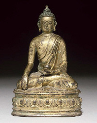 16th Century A Tibetan gilt bronze figure of Shakyamuni