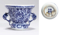 A blue and white two-handled quatrelobed cup