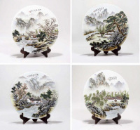signed Wang Ya Tin 1884-1942 Four porcelain circular plaques depicting the four seasons