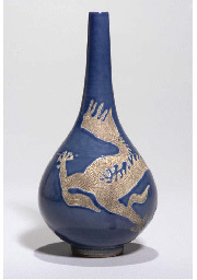 19TH CENTURY A BLUE-GLAZED AND BISCUIT PEAR-SHAPED BOTTLE VASE