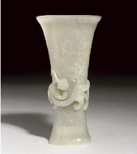 17TH/18TH CENTURY A CELADON JADE GU-SHAPED BEAKER