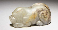 Ming Dynasty A celadon and russet jade mythical beast