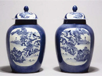 19th century A pair of powder-blue ground jars and covers