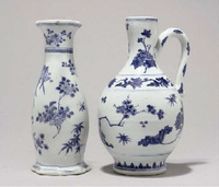 A blue and white ewer and a wall vase