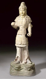 Sui/early Tang Dynasty A Gilt and painted straw-glazed figure of a soldier