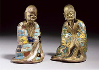 18th century A pair of gilt-copper and champleve enamel figures of Lohan