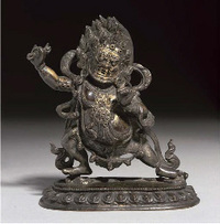 18th Century A Tibetan parcel gilt bronze figure of Mahakala