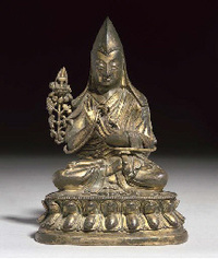 18th Century A Tibetan gilt-bronze figure of a Ge-lug-pa sect Lama