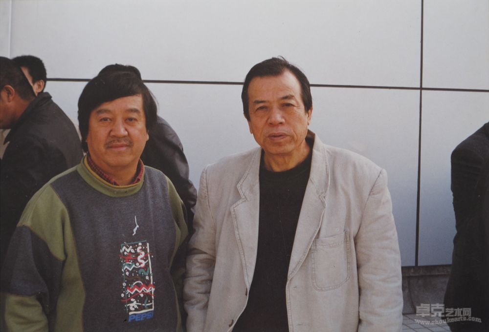 傅强在全国高校美术区工作会议上和中国油画学会副主席尚杨先生合影